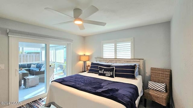 bedroom with access to exterior, multiple windows, and a ceiling fan