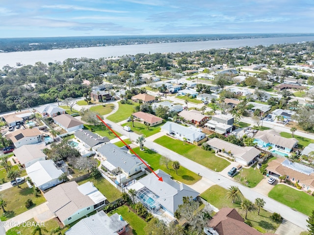 aerial view featuring a residential view and a water view