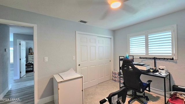 office area with visible vents and baseboards