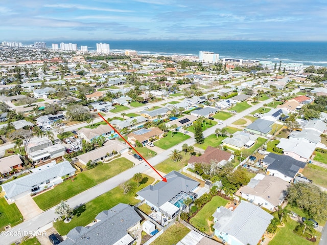 bird's eye view with a water view and a residential view