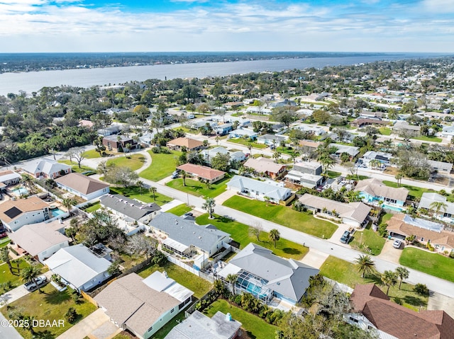 bird's eye view featuring a water view and a residential view