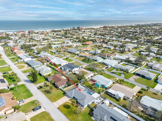 drone / aerial view with a residential view and a water view