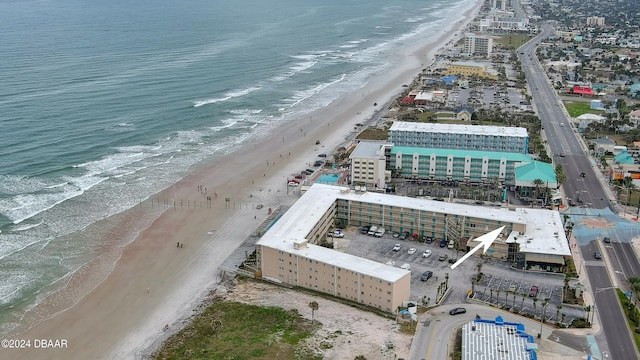 bird's eye view featuring a view of the beach and a water view