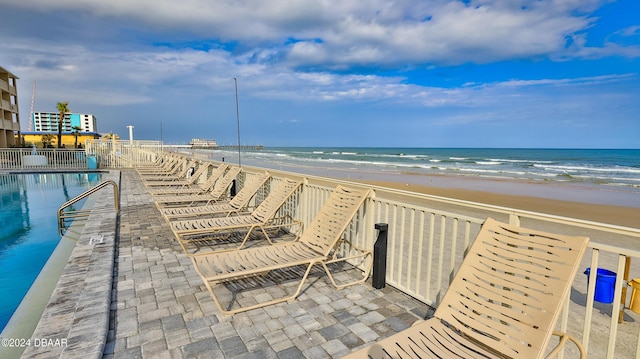 219 S Atlantic Ave Unit 440, Daytona Beach, FL 32118 - view of community featuring a pool and view of water and beach