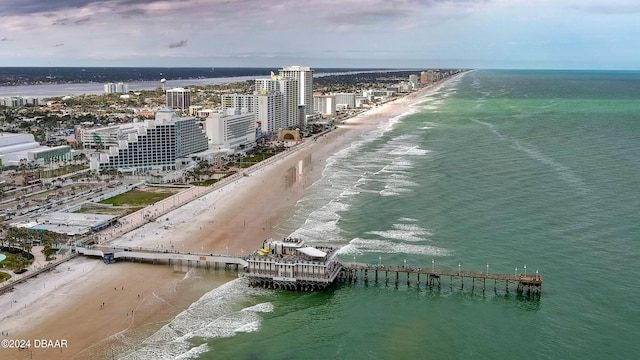 birds eye view of property featuring a view of the beach and a water view