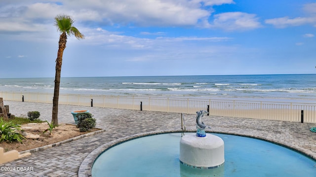 219 S Atlantic Ave Unit 440, Daytona Beach, FL 32118 - view of swimming pool with view of water and beach and fence