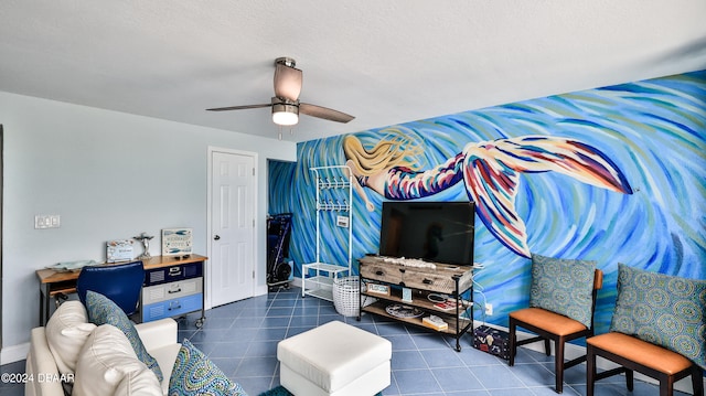 living room featuring a textured ceiling and ceiling fan