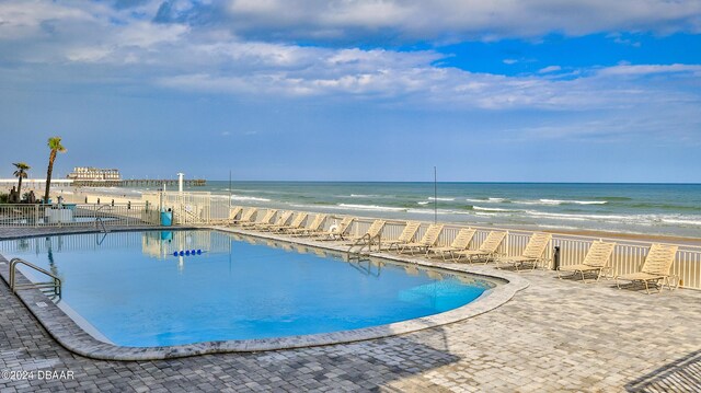 219 S Atlantic Ave Unit 440, Daytona Beach, FL 32118 - community pool featuring view of water and beach and a patio