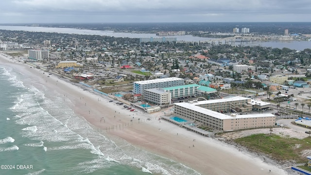 bird's eye view with a beach view and a water view