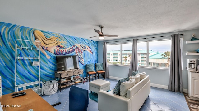 219 S Atlantic Ave Unit 440, Daytona Beach, FL 32118 - tiled living room featuring a ceiling fan, a textured ceiling, and baseboards