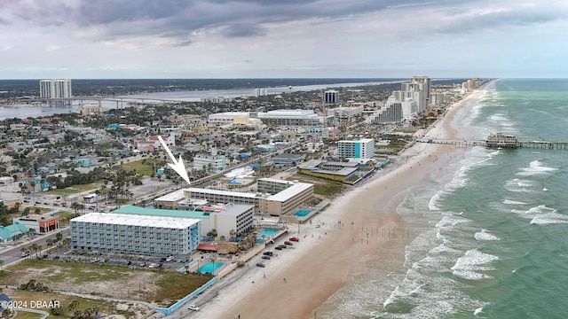 birds eye view of property featuring a view of the beach and a water view