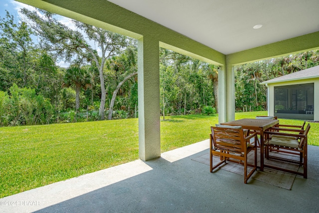 view of patio with a sunroom