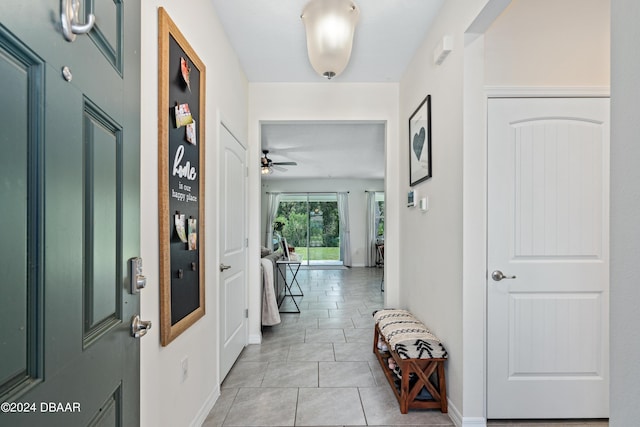 1743 Red Rock Rd, New Smyrna Beach, FL 32168 - foyer entrance featuring light tile patterned flooring and ceiling fan