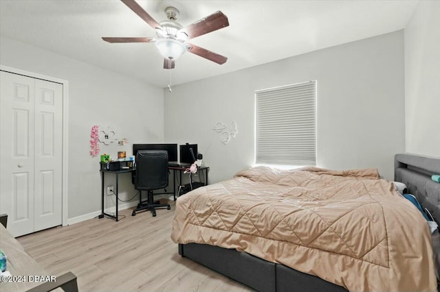 bedroom featuring light hardwood / wood-style floors, a closet, and ceiling fan