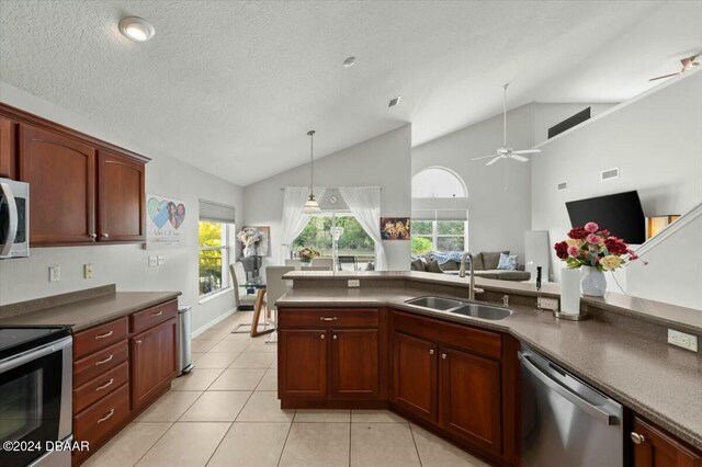 kitchen featuring stainless steel appliances, ceiling fan, sink, pendant lighting, and light tile patterned floors