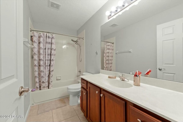 full bathroom with tile patterned flooring, shower / bath combination with curtain, a textured ceiling, toilet, and vanity