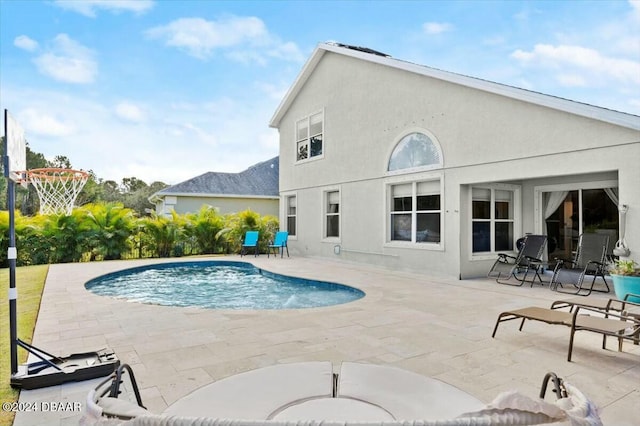 view of swimming pool with a patio area