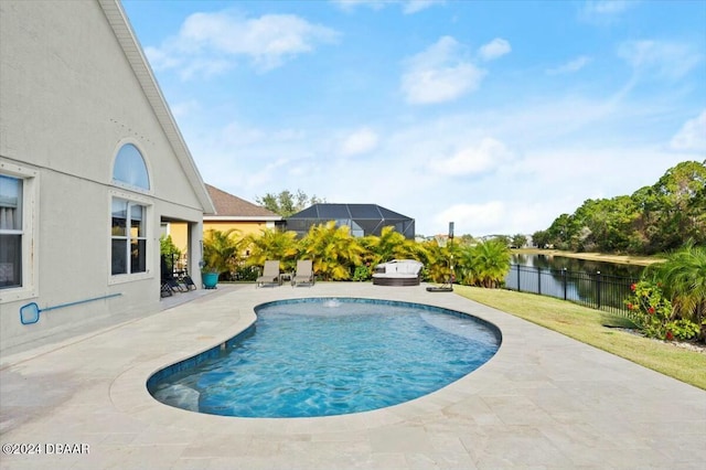 view of pool featuring glass enclosure, a jacuzzi, pool water feature, a water view, and a patio