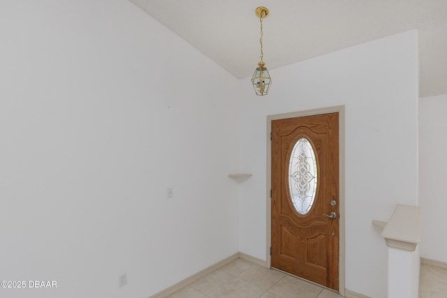 entryway featuring light tile patterned floors and baseboards