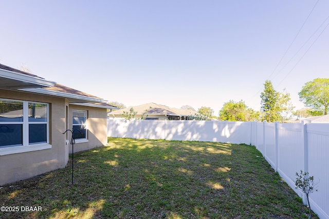 view of yard featuring a fenced backyard