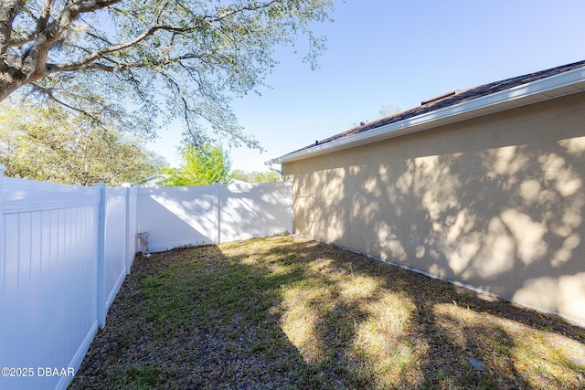 view of yard with a fenced backyard