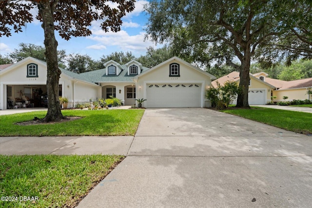 view of front of home featuring a garage and a front yard