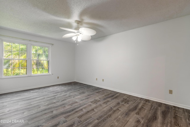 empty room featuring hardwood / wood-style floors, a textured ceiling, and ceiling fan