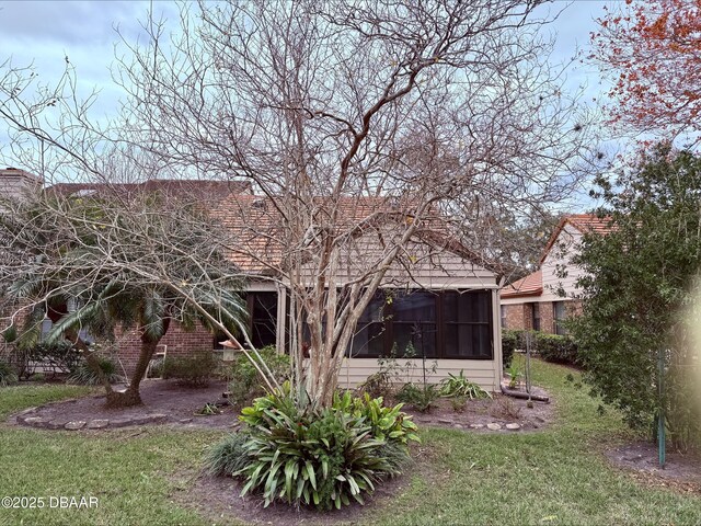 view of yard with a sunroom