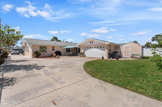 3167 S Peninsula Dr, Daytona Beach, FL 32118 - single story home featuring concrete driveway, a garage, fence, and a front lawn