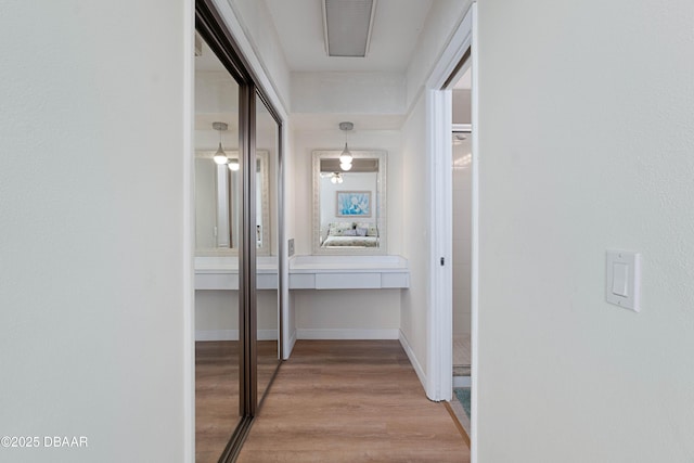 3167 S Peninsula Dr, Daytona Beach, FL 32118 - hallway with light wood-type flooring, baseboards, and visible vents
