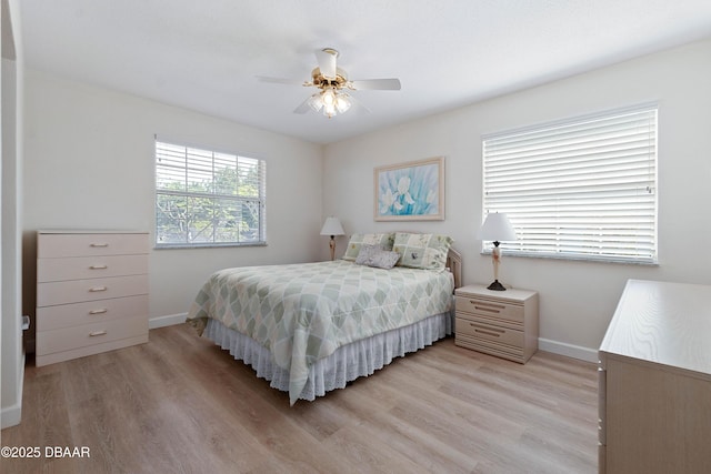 3167 S Peninsula Dr, Daytona Beach, FL 32118 - bedroom featuring light wood-style floors, baseboards, and ceiling fan