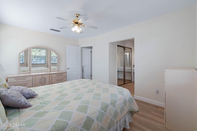 3167 S Peninsula Dr, Daytona Beach, FL 32118 - bedroom featuring ceiling fan, visible vents, baseboards, and wood finished floors