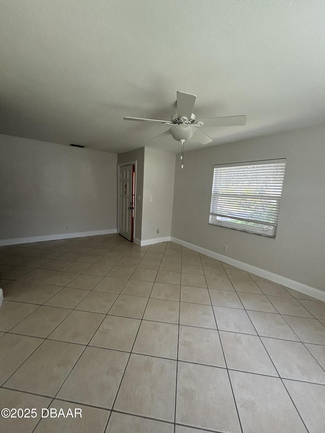 917 Royal Oak Ct, Holly Hill, FL 32117 - empty room with light tile patterned floors and ceiling fan