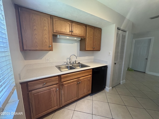 917 Royal Oak Ct, Holly Hill, FL 32117 - kitchen with dishwasher, light tile patterned floors, light countertops, and brown cabinets