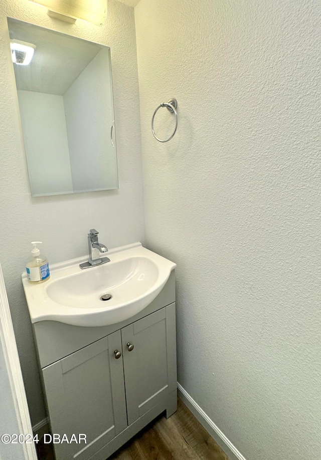 bathroom featuring vanity and wood-type flooring