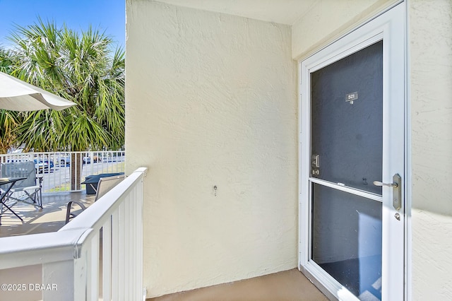 entrance to property with a balcony