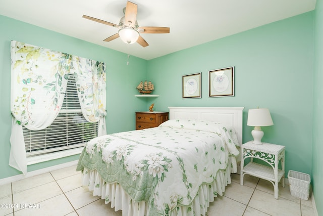 tiled bedroom with ceiling fan