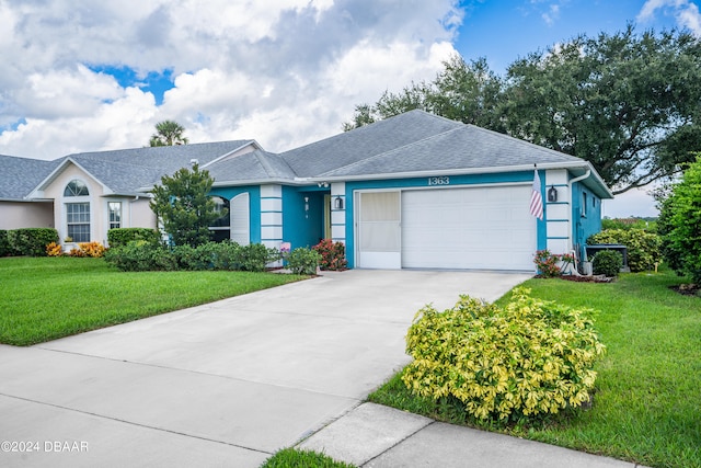 ranch-style home with a front lawn and a garage