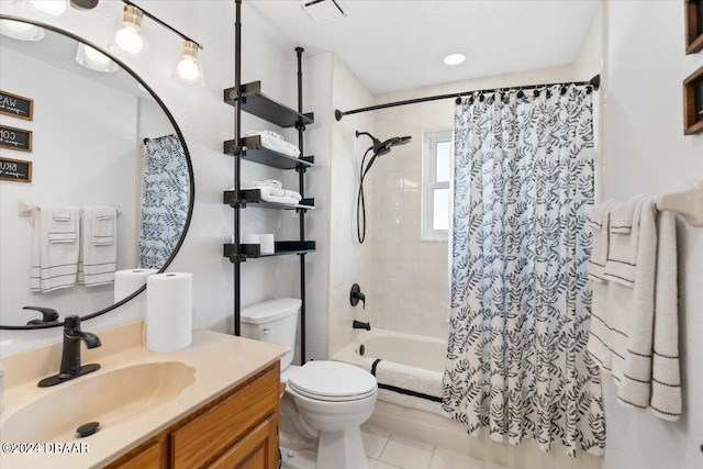 full bathroom with tile patterned flooring, vanity, shower / bath combo with shower curtain, and toilet