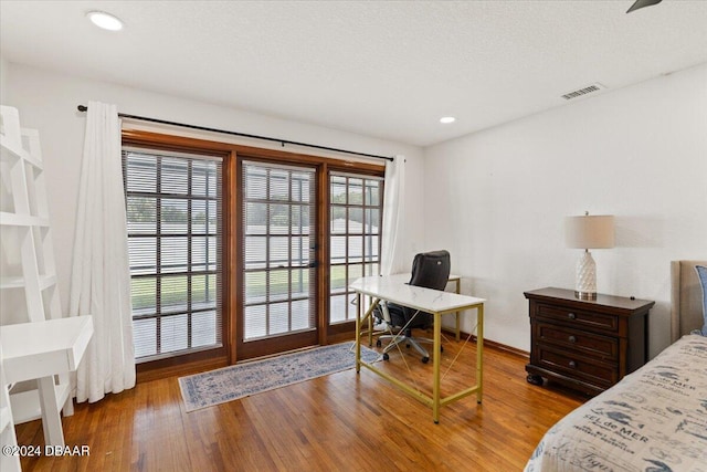 bedroom featuring hardwood / wood-style flooring