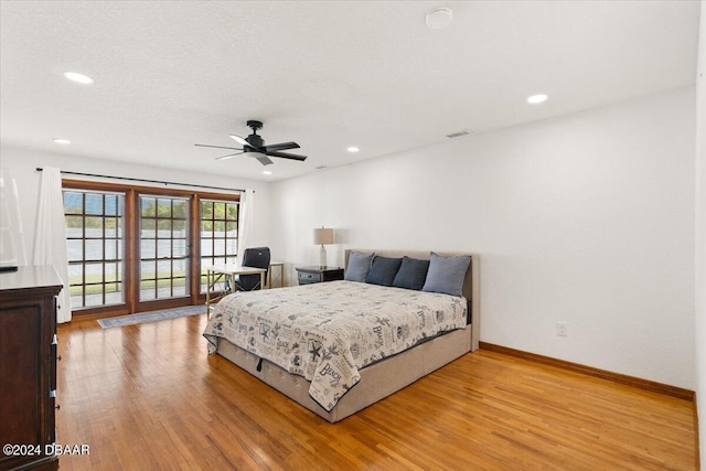 bedroom featuring ceiling fan and light hardwood / wood-style flooring