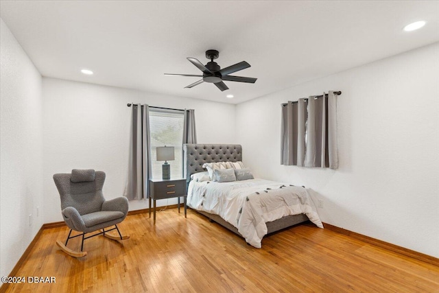 bedroom with hardwood / wood-style floors and ceiling fan