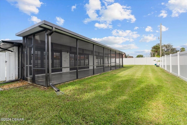 view of yard featuring a sunroom