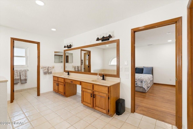 bathroom with hardwood / wood-style floors and vanity