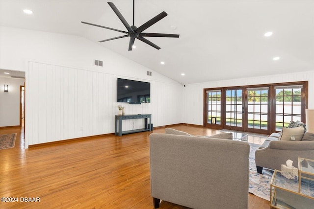 living room with french doors, wood-type flooring, ceiling fan, and vaulted ceiling