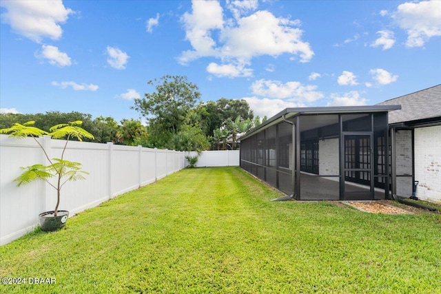 view of yard with a sunroom