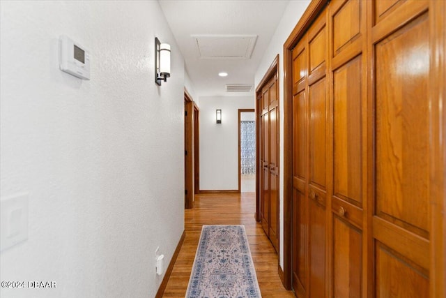 corridor featuring light wood-type flooring