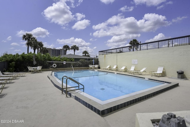 view of pool featuring a patio