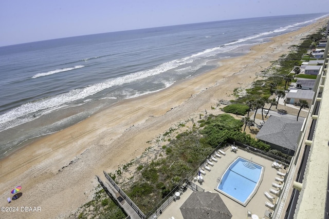 bird's eye view featuring a water view and a view of the beach