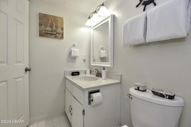 bathroom featuring tile patterned flooring, vanity, and toilet